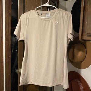 Nude Gymshark workout top.